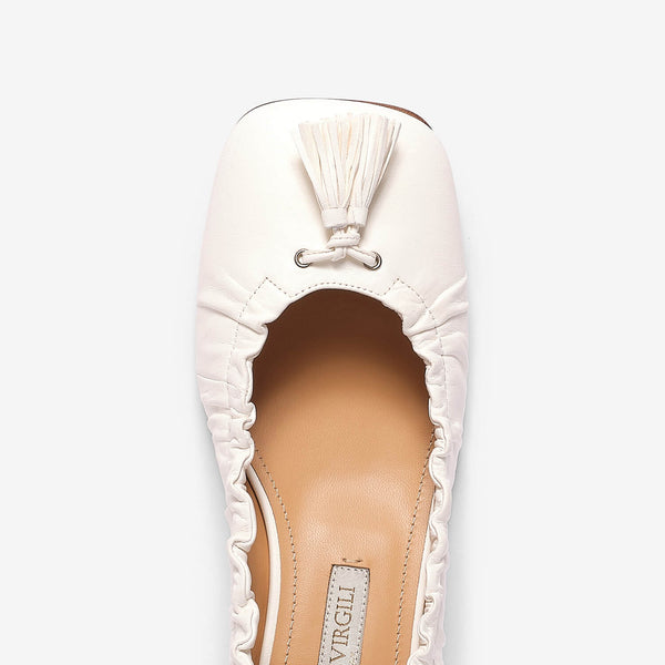 White women's tassel leather décolleté